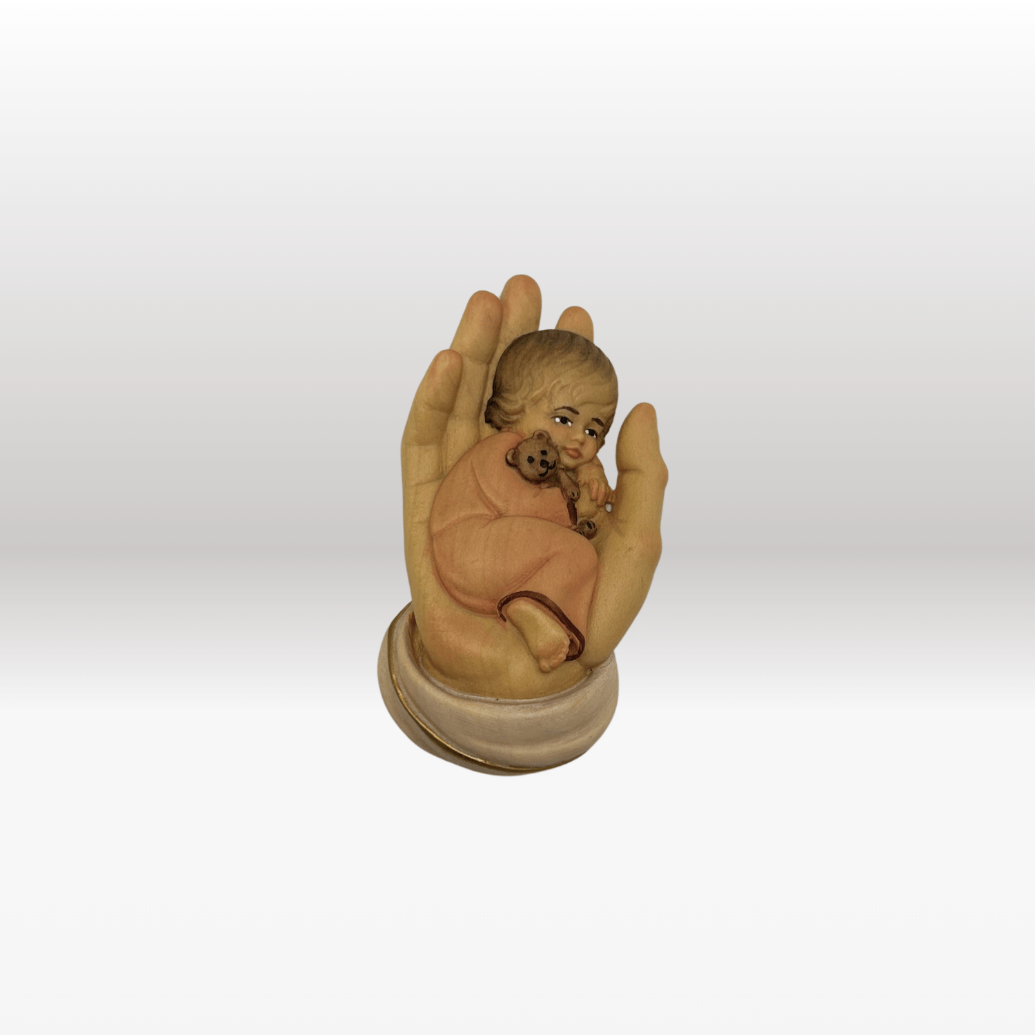 Schützende Hand mit Mädchen